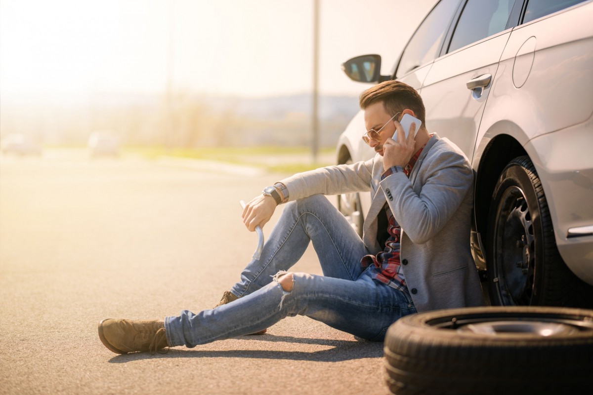 Man broken down with flat tire