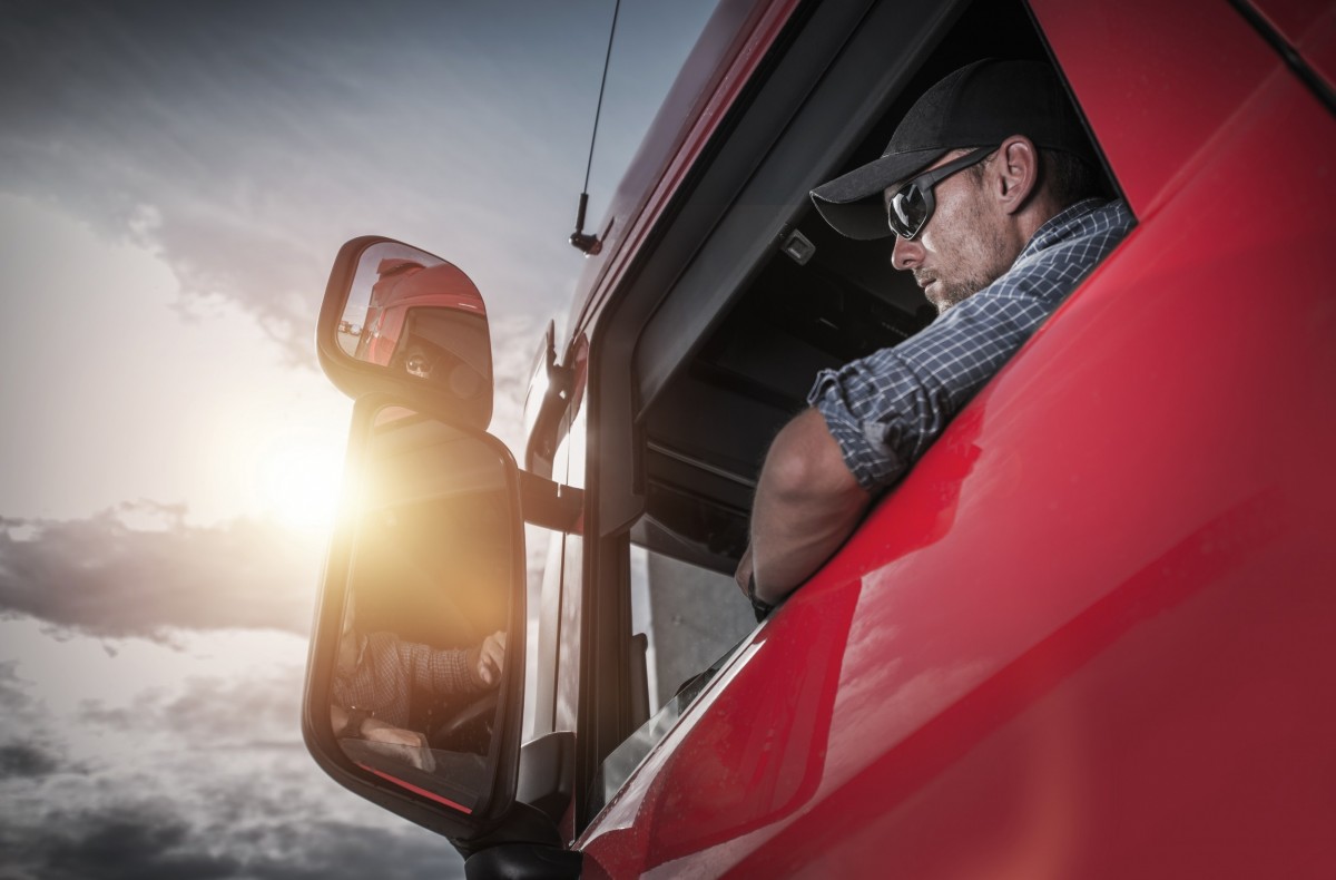 man driving a diesel truck