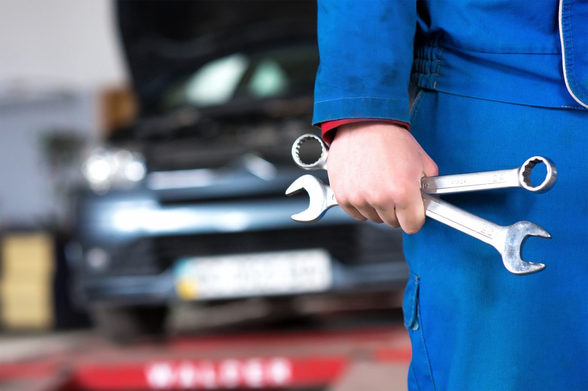 mechanic holding tools